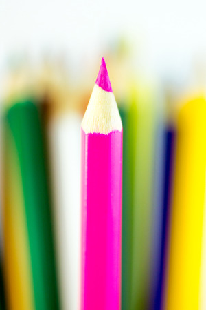 One colored pencil in front of some otherの写真素材
