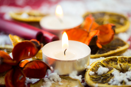 Christmas tea light candle with dried fruitsの写真素材