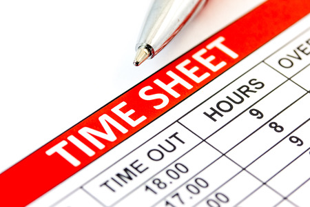 Compiled Time sheet with a pen - business conceptの写真素材