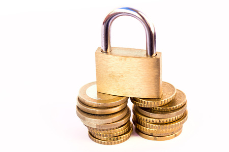 Coins and padlock - financial saving conceptの写真素材