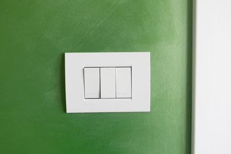 White light socket on a green backgroundの写真素材