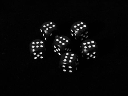 black dice on black backgroundの写真素材