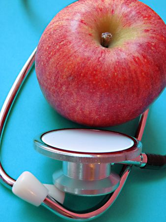 Fresh,healthy apple and stethoscopeの写真素材