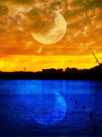Beautiful sunset and outstanding moon and its reflectionの写真素材