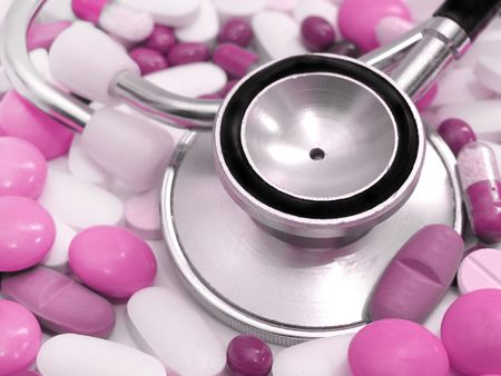  stethoscope and colored pillsの写真素材
