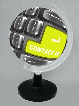 OGreen Contact Us key on a computer keyboard placed on the globe    
