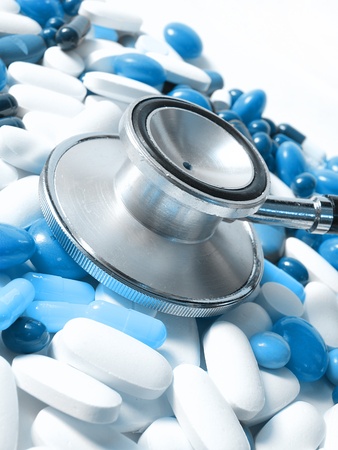 stethoscope and colored pillsの写真素材