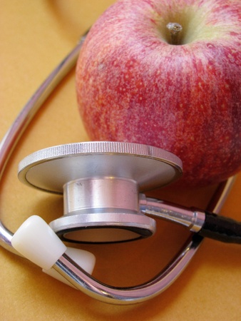 stethoscope and red apple の写真素材