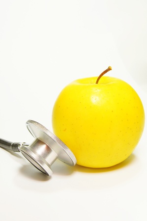 Medical stethoscope and apple の写真素材