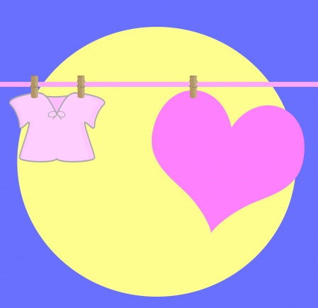 heart drying on a wire , with baby clothe,on a moonlightの写真素材