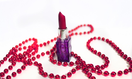 isolated red lisptick with red pearls isolated on white backgroundの写真素材