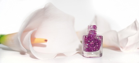nail polish and soft white flowerの写真素材