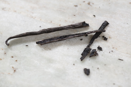 Open vanilla bean on marble closeupの写真素材
