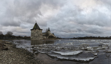 Ancient fortress on the river bank. Russia. Pskov Kremlin. Pskov spring time.  ice driftのeditorial素材