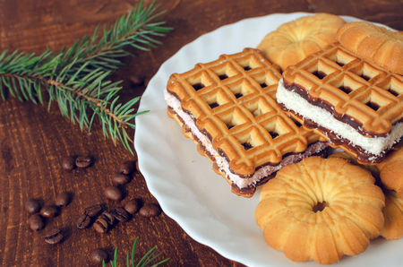 Plate with fresh cookies on dark wooden board. Top view. Vintageの写真素材