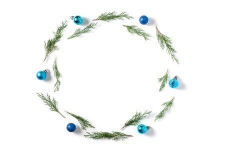 Christmas background. Blue and lilac balls, fir tree branches on white background. Christmas,...