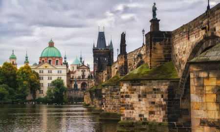 Scenic spring view of the Old Town pier architecture and Charles Bridge over Vltava river in Prague, Czech Republic . Clouds.の写真素材