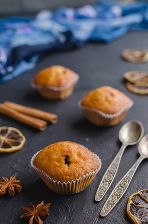 Sweet muffins with on dark textured background. Selective focus.の写真素材