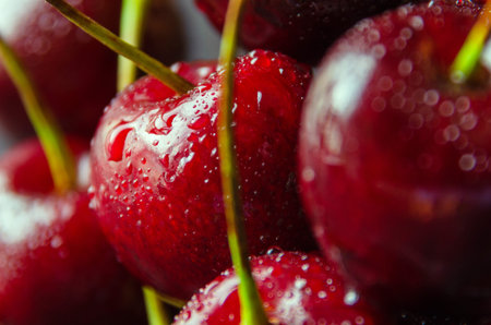 Close up of fresh cherry berries with water drops.