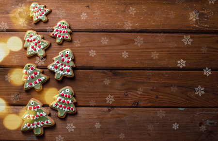 Homemade colorful gingerbread cookies on dark wooden background. Top view. Copy space.