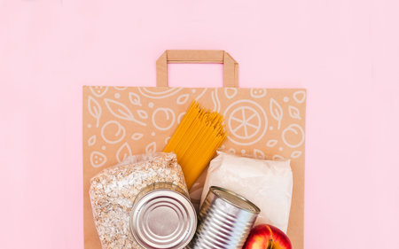 Food for quarantine isolation period flat lay on yellow background with copy space. Eggs, pasta,...