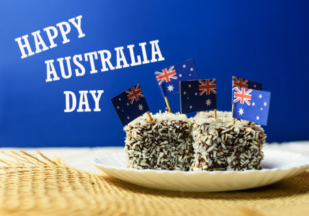 Iconic traditional Australian party food, Lamington cakes on a red, white and blue background.の写真素材