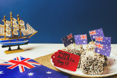 Iconic traditional Australian party food, Lamington cakes on a red, white and blue background.の写真素材