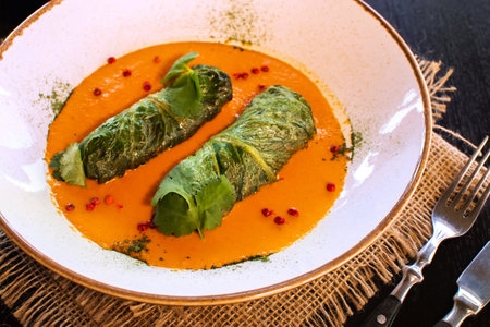 Side view on a dish of eastern european cuisine golubtsy stuffed cabbage leaves with meat or...