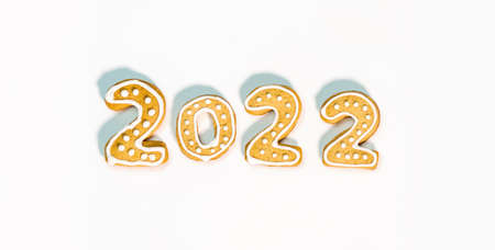 Gingerbread cookies in the form of numbers, gingerbread New Year 2022 festive decor on white background .の写真素材