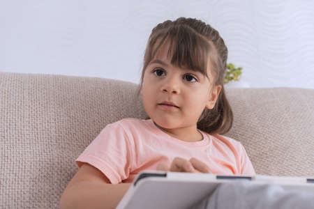 Girl using Phone smartphone viewing screen on phone or tablet press browsing.の写真素材