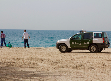DUBAI, UAE - APRIL 16, 2012: A police car (SUV) at the Jumeirah beachのeditorial素材
