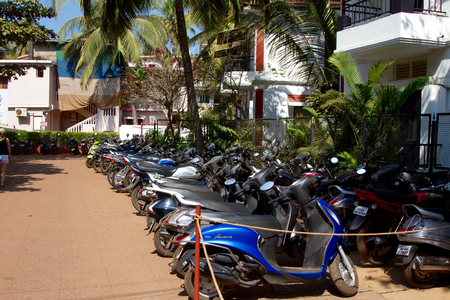 Goa, India - December 16, 2016: Many 2 wheeler vehicles parked next to a streetのeditorial素材