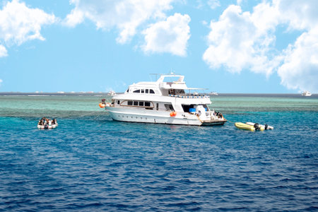 Modern Egyptian Diving Boat In The Sea Near Coral Reef Island. White Marine Pleasure Craft With...