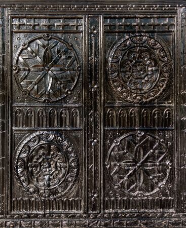 Old Wooden Vintage Craft Furniture. Carved Wood Texture. Dark Brown Varnished Wood Handmade Arabesque Pattern. Royal Ornate Design Decoration.の写真素材