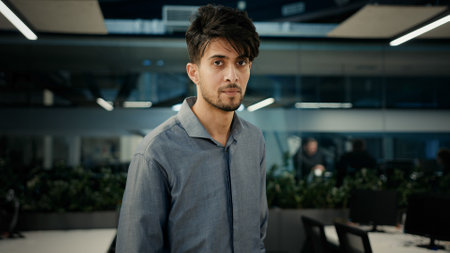 Indian 30s man businessman adviser smiling ethnic male entrepreneur office worker pointing index finger choosing you approve business idea support agree talking in online video conference webcam viewの写真素材