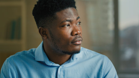 Thoughtful businessman adult ethnic African American man thinking indoors smart pondering executive worker manager specialist think planning dreaming business ideas thoughts brainstorming create planの写真素材