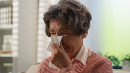 Caucasian sick grandmother unwell  at homeの写真素材