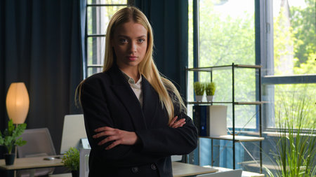 Strong Caucasian woman businesswoman boss CEO female entrepreneur director employer independent owner business leader crossed hands at office confident power girl feminism crossing arms in formal suitの写真素材