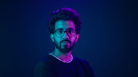 Portrait Indian serious man developer coding worker programmer profile looking to side turn head...