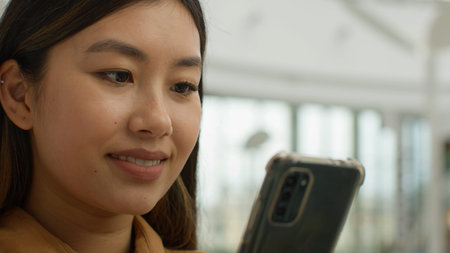 Close up smiling Asian chinese japanese woman portrait multiracial girl businesswoman read social...