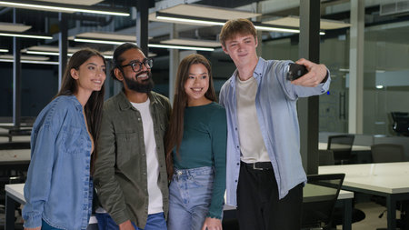 Multiethnic diversity creative business team young friends girls guys smile taking selfie in modern...