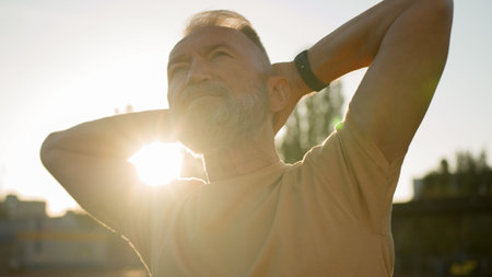 Close up aged Caucasian man old sportsman morning training warm-up sporty lifestyle exercise retired...