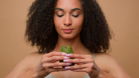Portrait African American beautiful smiling woman girl female with curly hair healthy skin care...