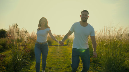 Happy laughing Caucasian lovers couple family bearded man male husband smiling woman wife female...
