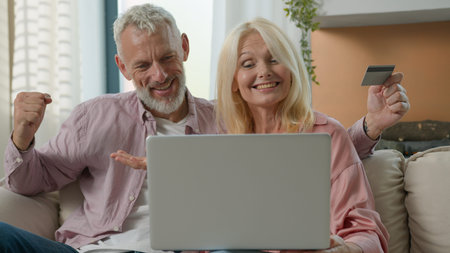 Happy family senior 50s Caucasian couple elderly female woman male man talking online video call...