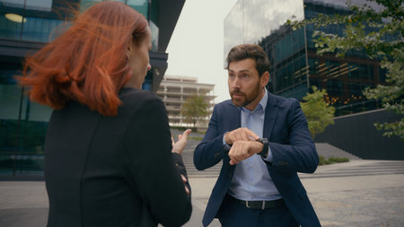 Angry negative conversation business misunderstanding communication corporate deal problem trouble businesswoman arguing with authority businessman argue conflict quarrel colleagues in city stressの写真素材