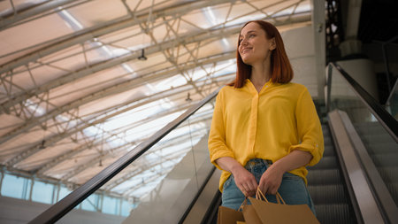 Happy joyful glad Caucasian female woman girl shopper client customer consumer tourist hold many...