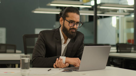Busy concentrated Indian male employer company corporate Arabian entrepreneur boss CEO business man...