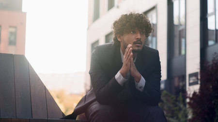 Indian businessman Arabian business man employer entrepreneur think problem analysis issue trouble annoyed anxiety stress ponder thinking anxious bad bankrupt worker bankruptcy brainstorming in cityの写真素材