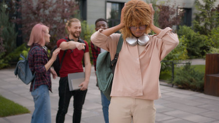 Group of angry students teenagers multiracial classmates mock humiliate bully mockery at college...
